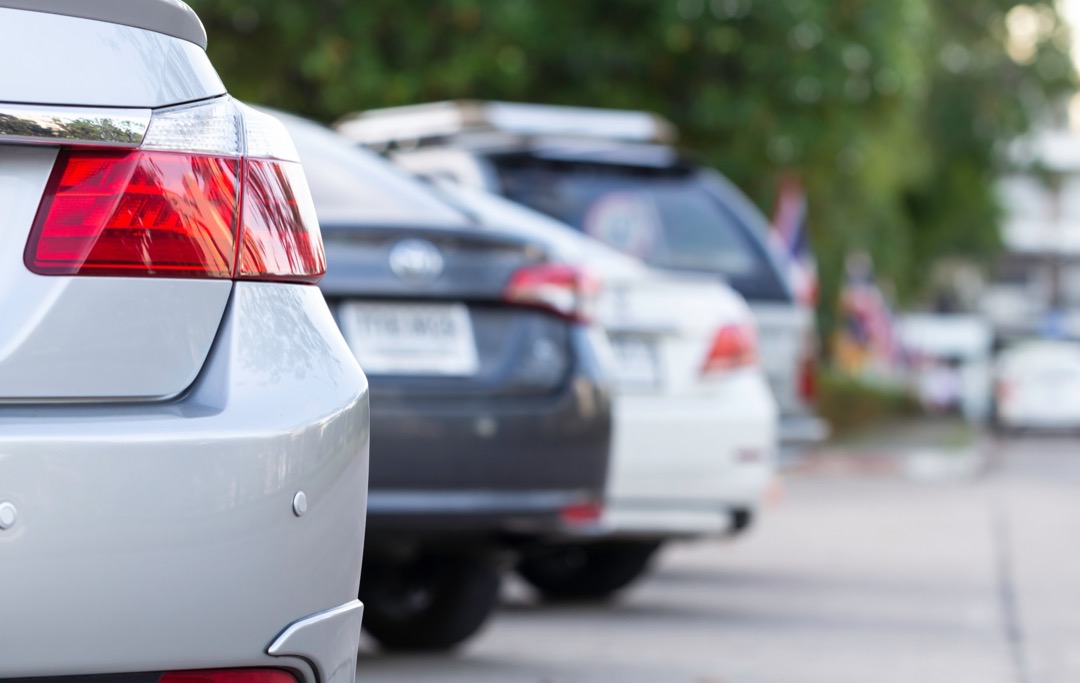 Cars parked in a row in a parking lot