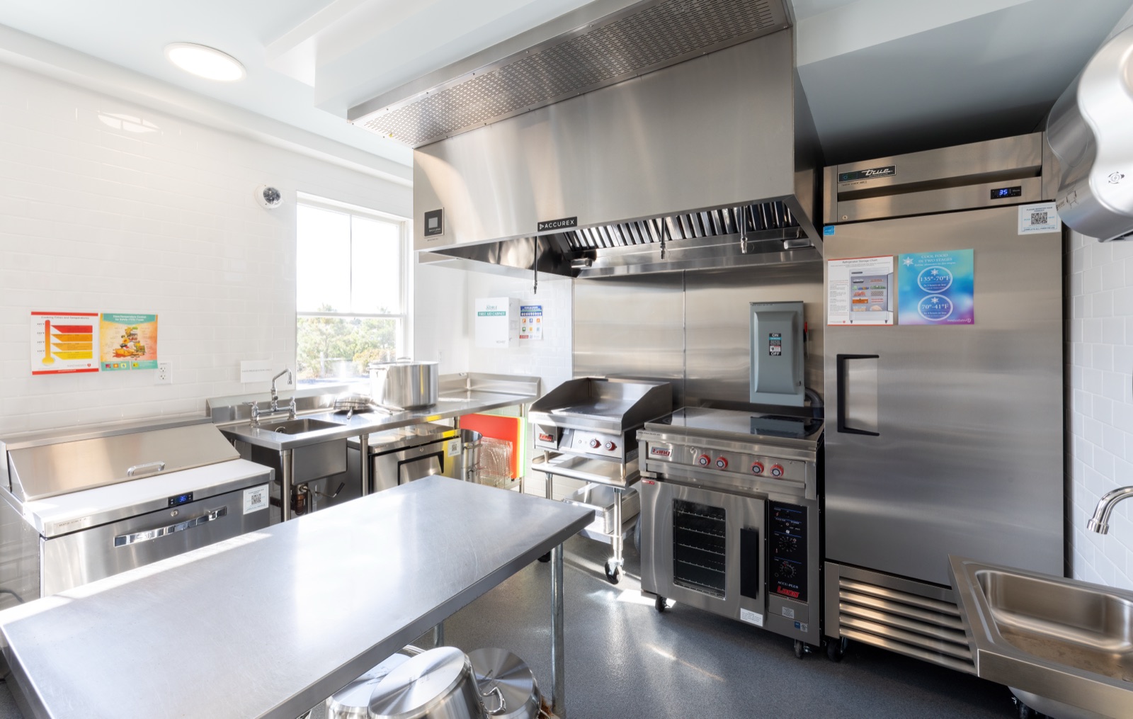 Stainless steel ranges and refrigeration in a Hive kitchen