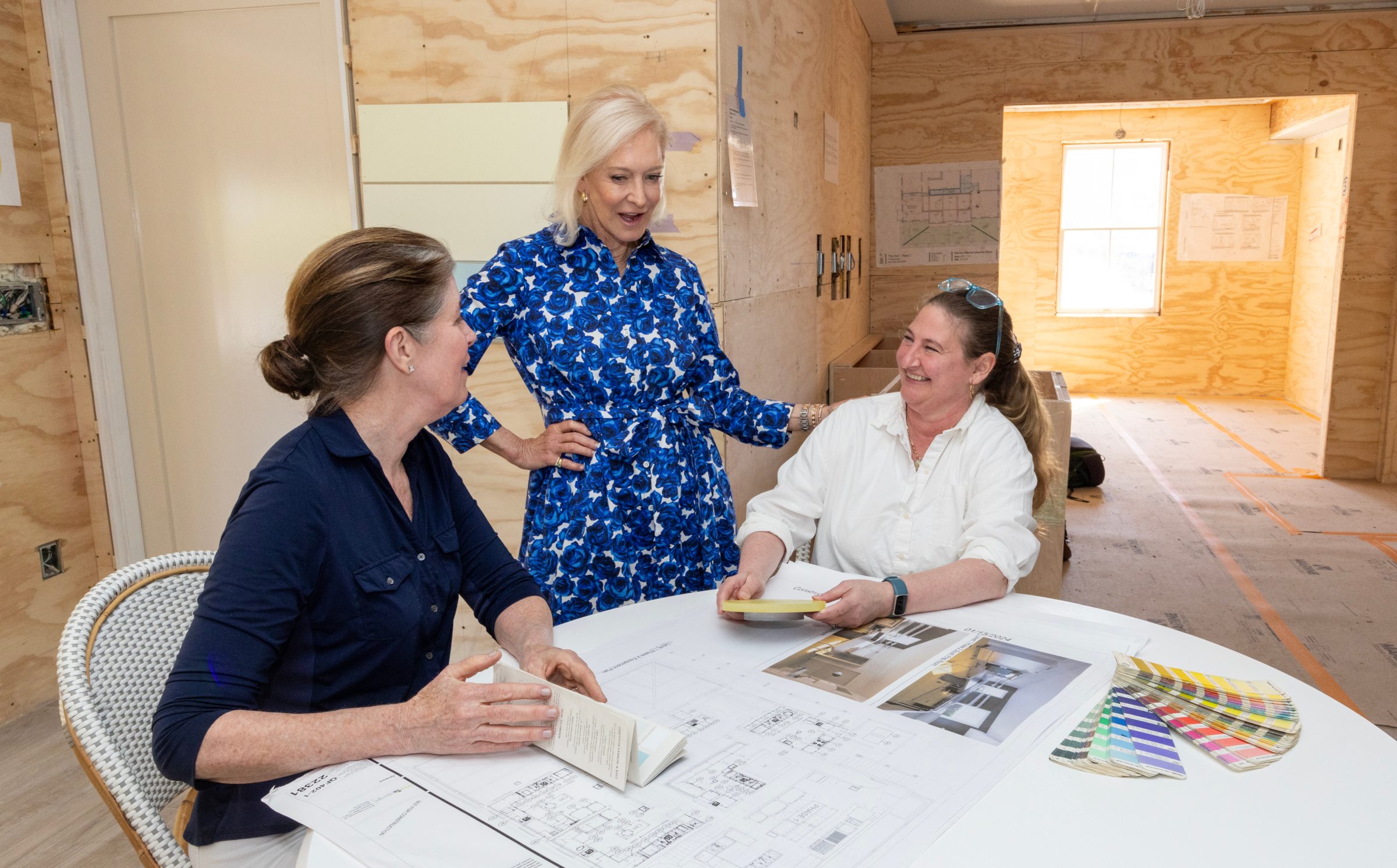 Planning The Hive around a table inside 5 Amelia Drive during construction
