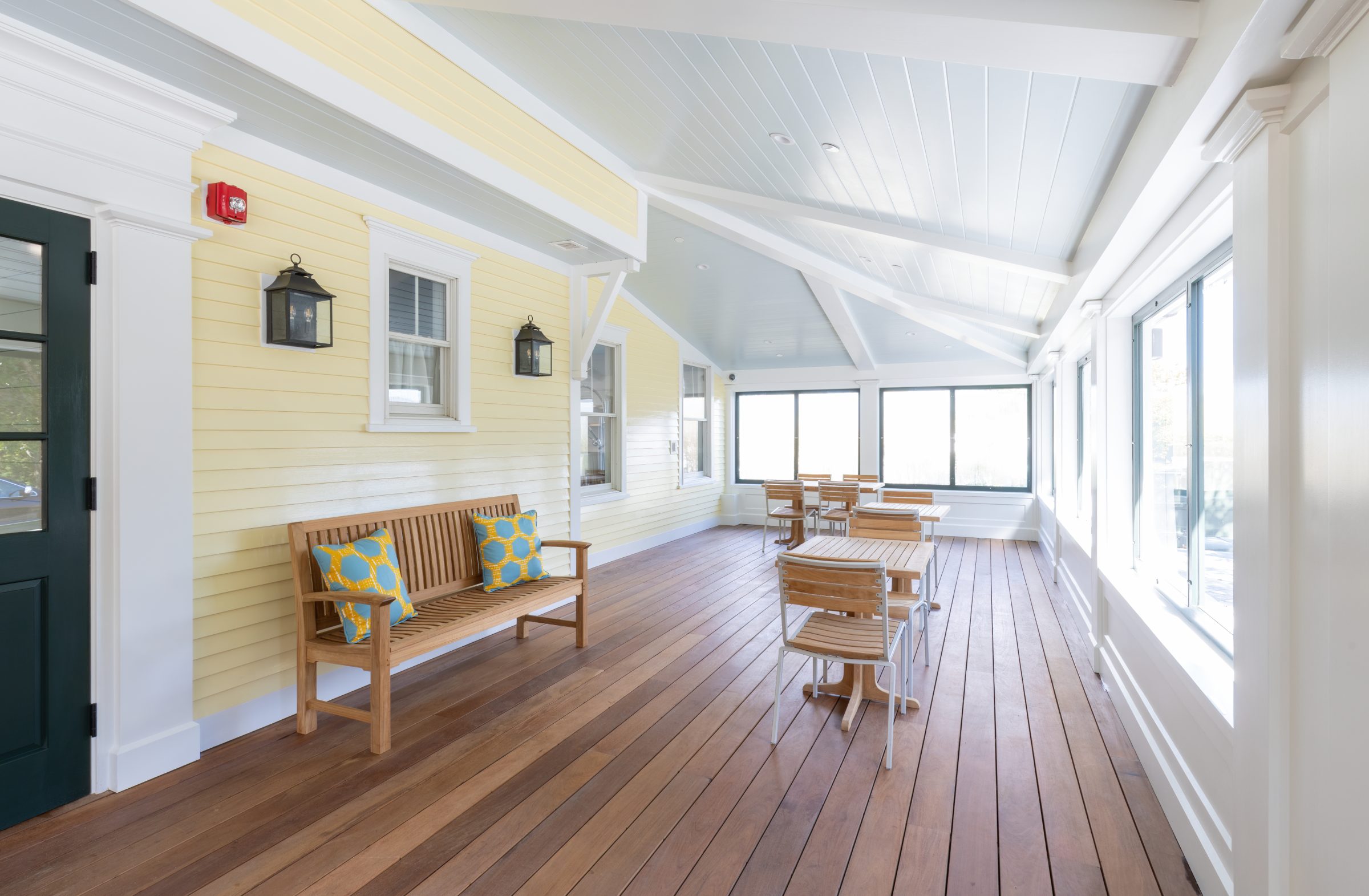 The Hive’s sunlit porch dining area